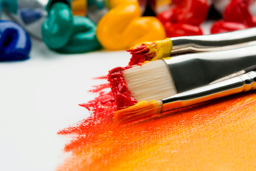 Paint brushes used to create a custom oil painting from a photo