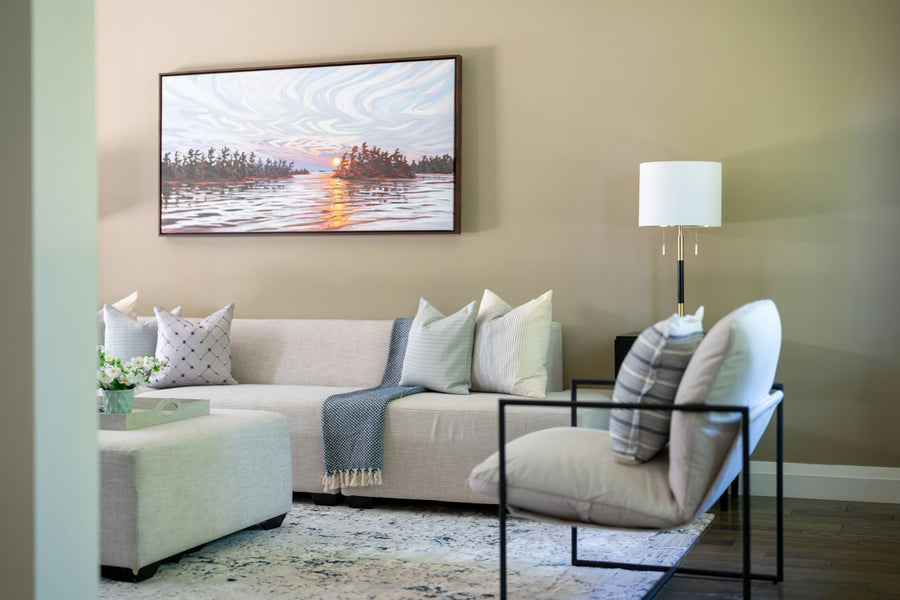 Living room with a sunset canvas painting on the wall